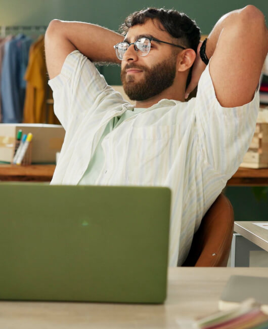 Relaxed employee at desk