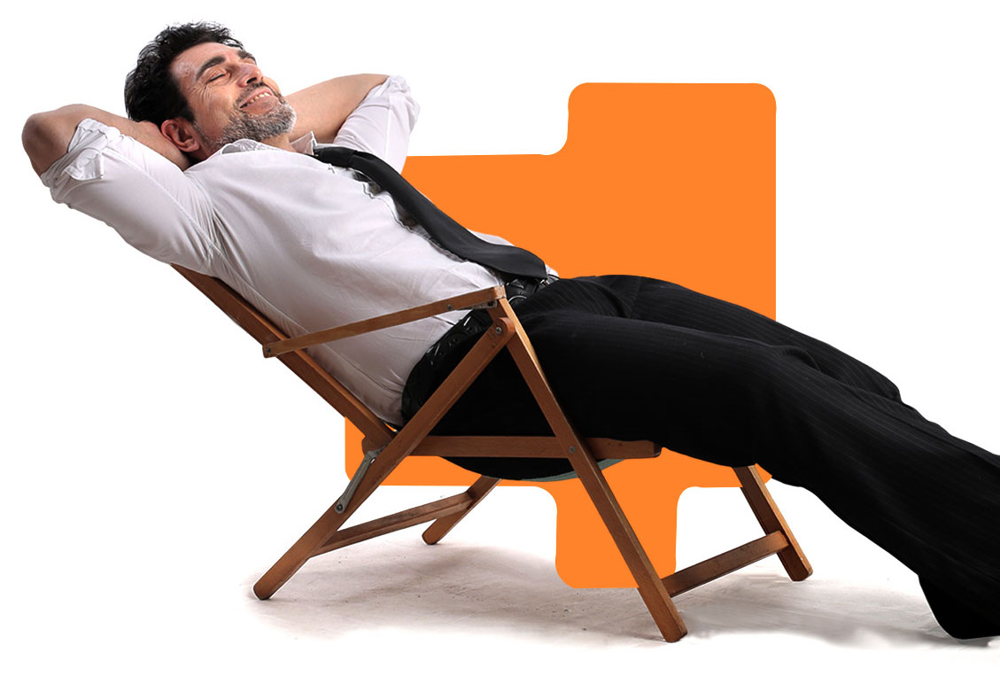 Marketing executive relaxing in a chair while vizibl takes care of everything